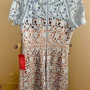 The dress is the brocade of the fabric is beautiful and the color